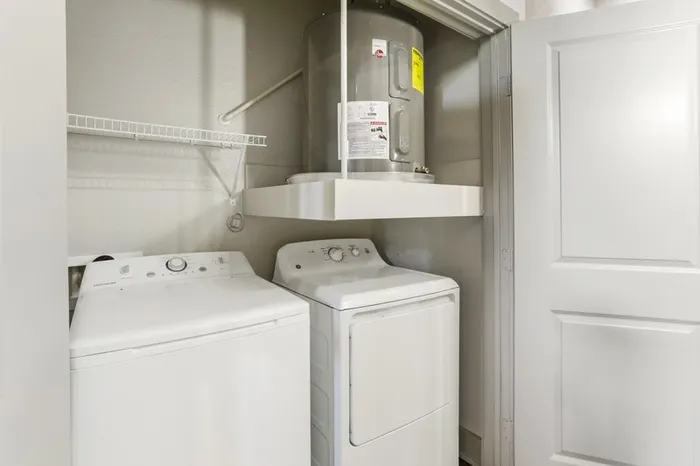 Individual washer and dryer in closet at Lantower Legacy Lakes
