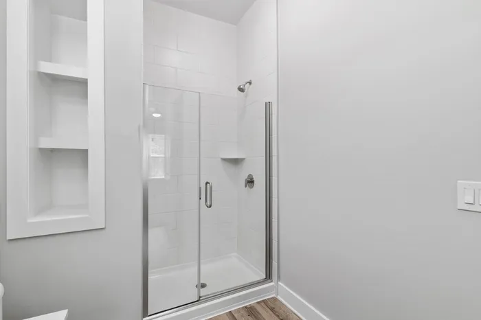 Walk-in, glass door shower at Lantower Weston Corners.