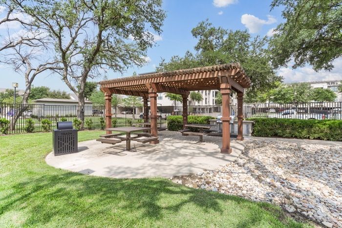 Resort style grilling and barbeque area with plenty of space for seating, eating, and outdoor activities at Lantower Residences at the Collection