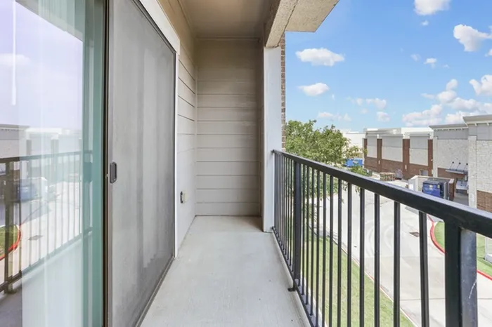 Private outdoor patio and balcony with access through a sliding glass door at Lantower Residences at the Collection