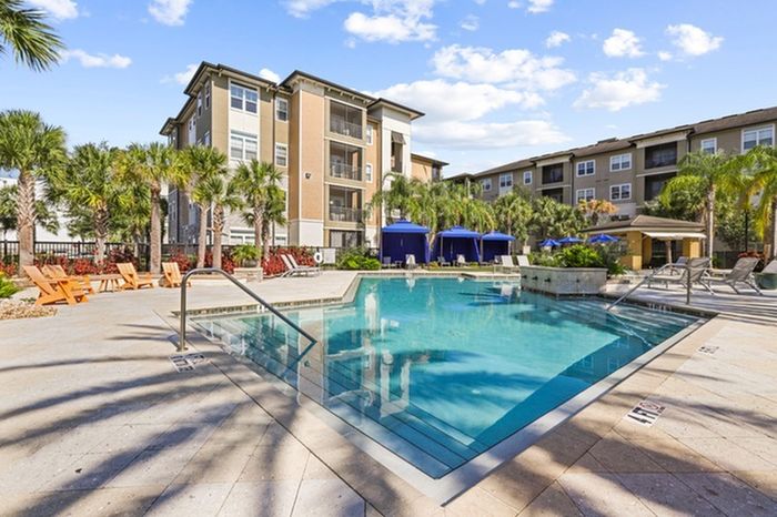Resort-style pool with sundeck and lounge chairs at Lantower Brandon Crossroads.