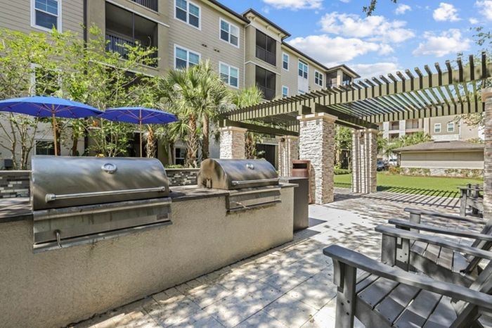 Grilling station with stainless steel, gas grills at Lantower Brandon Crossroads Apartments.