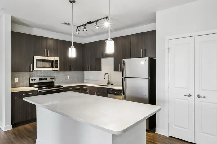 Chef-inspired kitchen with brushed nickel fixtures, 9-foot ceilings, and a kitchen island at Lantower Brandon Crossroads.