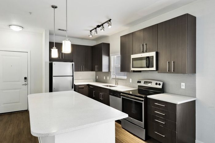Chef-inspired kitchen with brushed nickel fixtures, 9-foot ceilings, and a kitchen island at Lantower Brandon Crossroads.