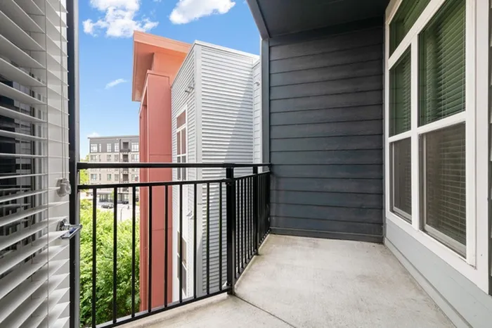 Balcony at Bullhouse with a view of trees.
