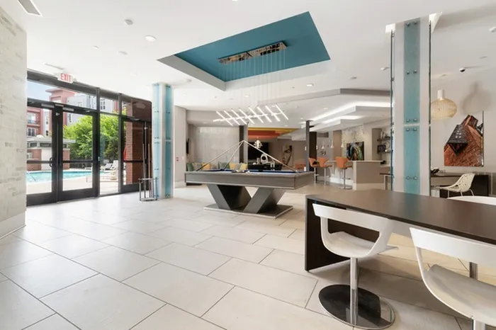 Clubhouse with a billiard table and bar seating area at Lantower Bullhouse.