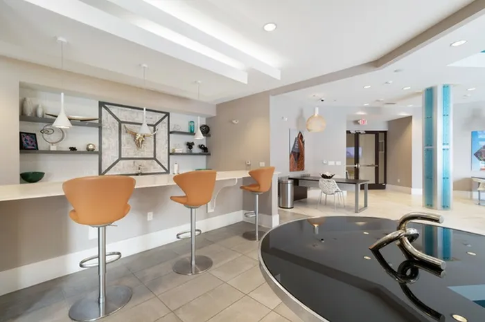 Clubhouse with a billiard table and bar seating area at Lantower Bullhouse.