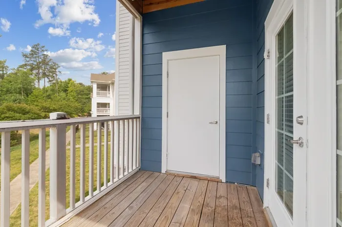 Balcony at Realm at Patterson Place with a view of trees.