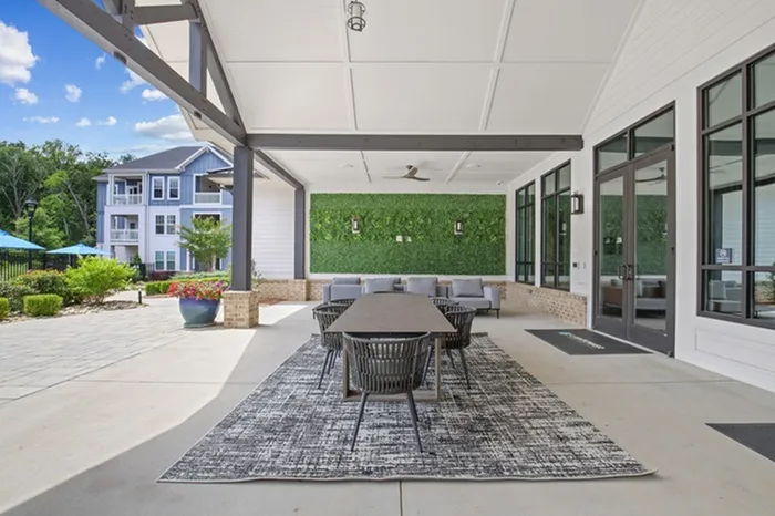 Al Fresco dining area next to the summer kitchen with stainless steel grills at Lantower Garrison Park.