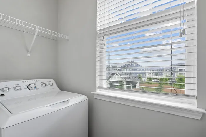 Laundry room with in-unit washer and dryer at Lantower Garrison Park.