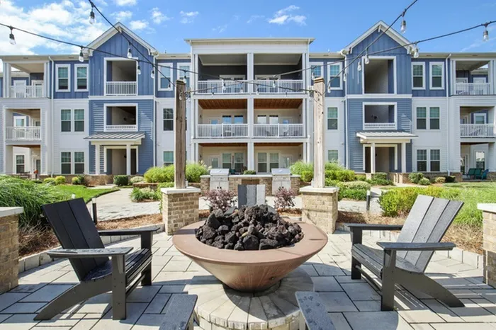 Fire pit area at Lantower Garrison Park with patio chairs.