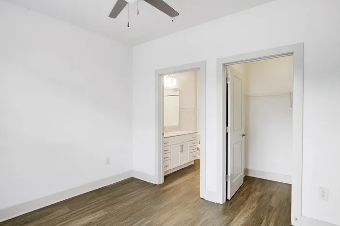 Bedroom with a connected bathroom and a walk-in closet at Lantower Waverly.
