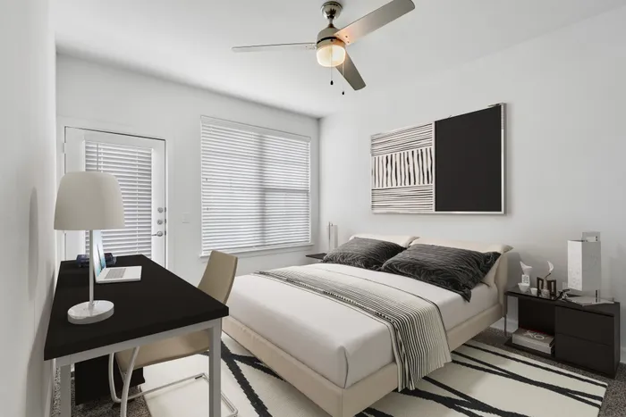Spacious bedroom with ample room for furniture, natural sunlight and classic finishes at Lantower Ambrosio Apartments.