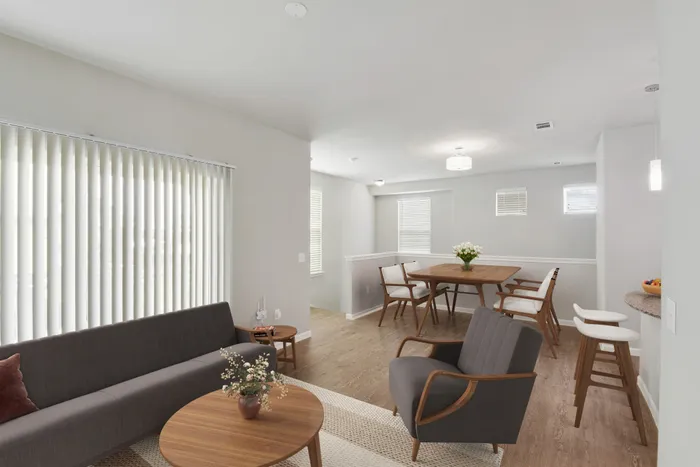 Spacious living room with faux wood flooring and natural lighting at Lantower Edgewater