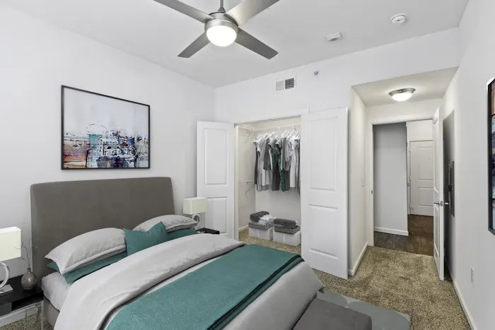 Bedroom with carpet flooring, walk-in closet, and ample room for furniture at Lantower Techridge