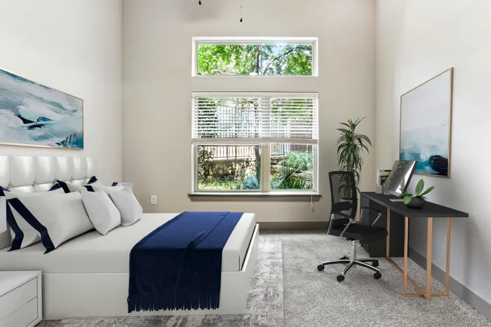 Bedroom with carpet flooring, and large square window providing natural light at Lantower Legacy Lakes