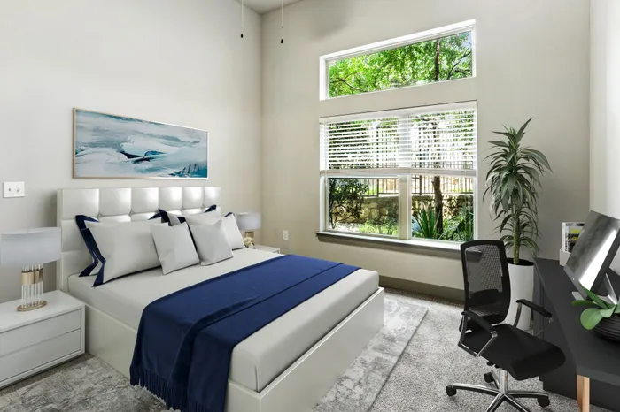 Bedroom with carpet flooring, and large square window providing natural light at Lantower Legacy Lakes