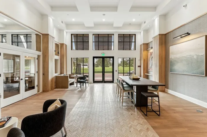 Community room with ample seating and natural light at Lantower Westshore.