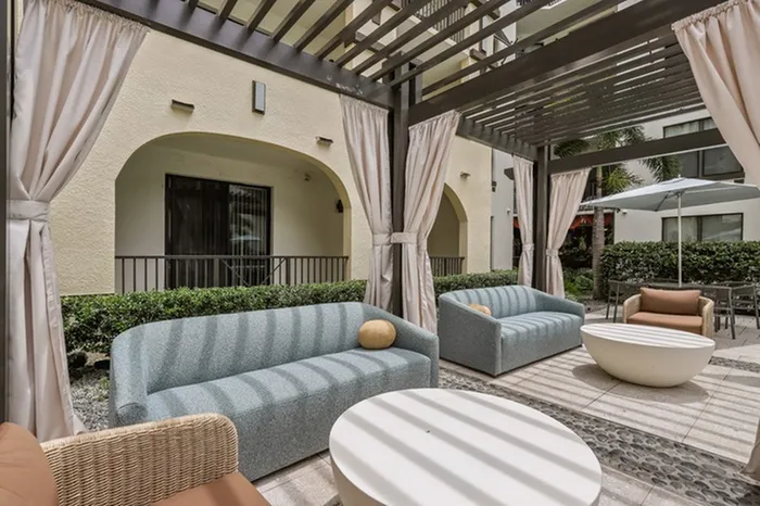 Swimming pool courtyard cabanas with privacy curtains at resort-style pool at Lantower Westshore.