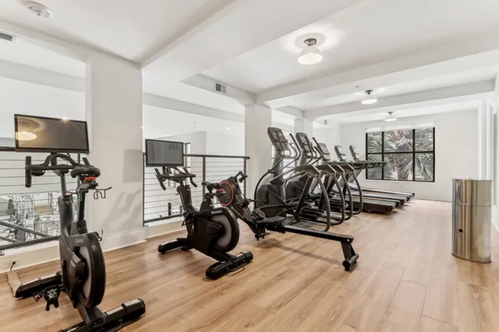 Spacious state-of-the-art fitness center with free weights, TRX, weight machines, and cardio equipment at Lantower Westshore.