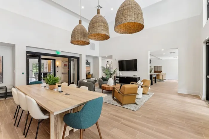 Clubhouse with billiards table, shuffleboard, full kitchen, wall-mount television, and ample seating at Lantower Westshore.