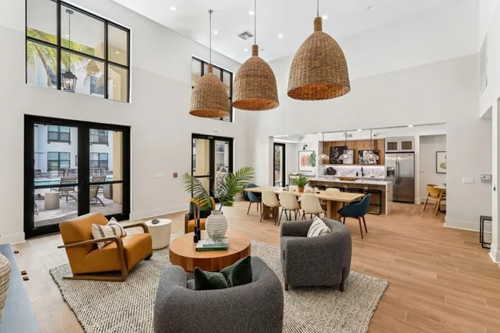 Clubhouse with billiards table, shuffleboard, full kitchen, wall-mount television, and ample seating at Lantower Westshore.