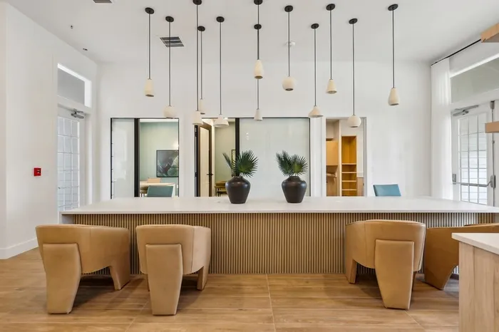 Lantower Tortuga Bay community office with desks and bright lighting.