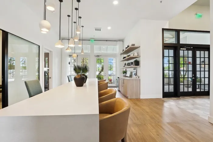 Community room with natural light and ample seating at Tortuga Bay at Waterford Lakes.
