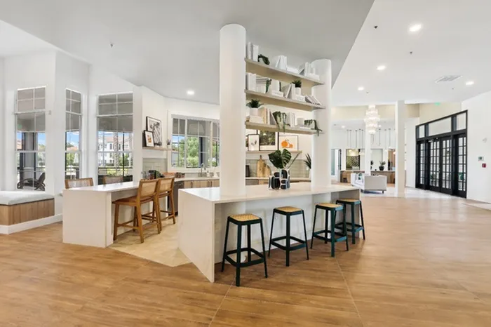 Community room with natural light and ample seating at Tortuga Bay at Waterford Lakes.