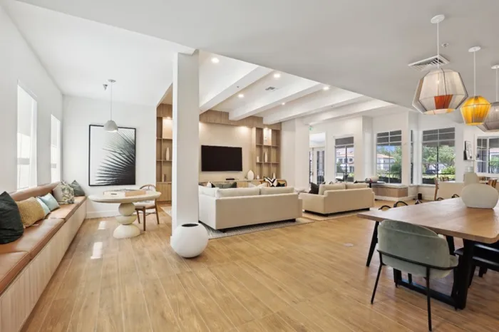 Community room with natural light and ample seating at Tortuga Bay at Waterford Lakes.
