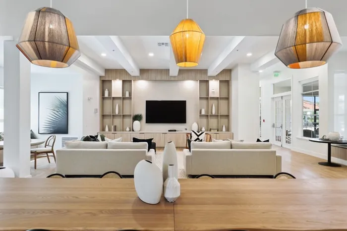 Community room with natural light and ample seating at Tortuga Bay at Waterford Lakes.