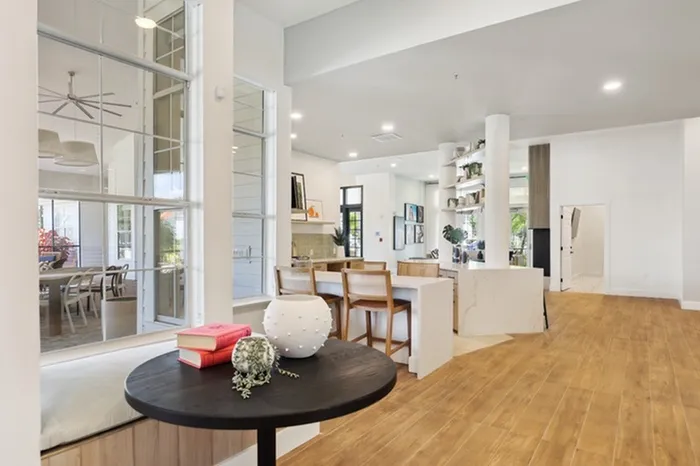 Community room with natural light and ample seating at Tortuga Bay at Waterford Lakes.