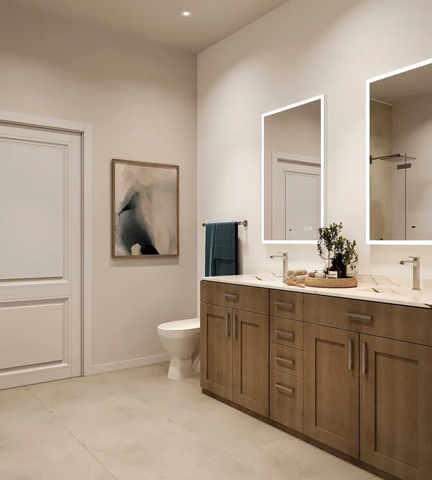 Elegant bathroom with double vanity, sleek mirrors, and soft lighting, perfect for relaxation.