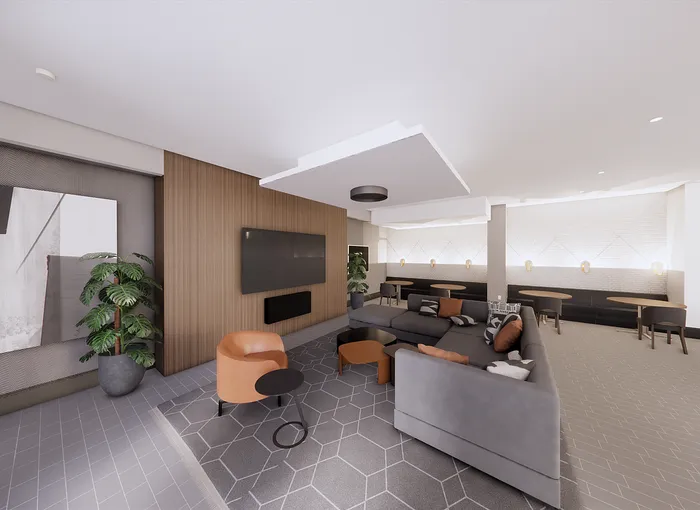 Sleek modern living room with a spacious gray sectional sofa, stylish orange accents, wall-mounted TV, and elegant wood paneling.
