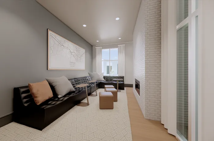 Elegant and cozy living room featuring a sleek black sofa, modern fireplace, and natural light streaming through large windows.