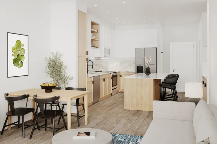 Contemporary open-plan living area with modern kitchen, sleek countertops, stylish dining table, and cozy seating, perfect for entertaining.