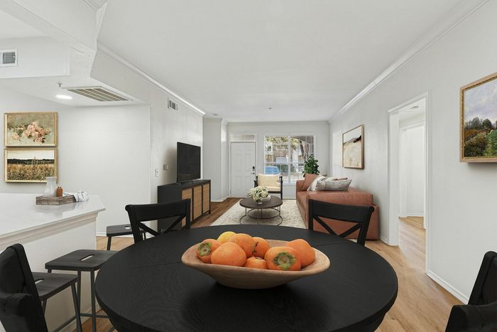 Modern and bright living space featuring an elegant open-concept design with cozy seating, stylish decor, and abundant natural light.