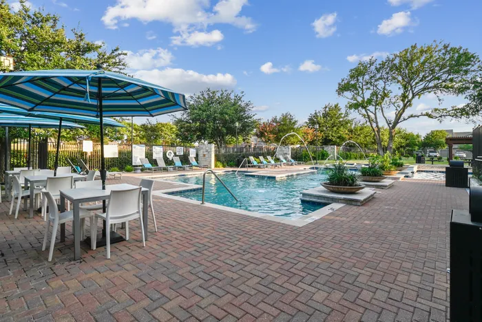 pool with picnic tables