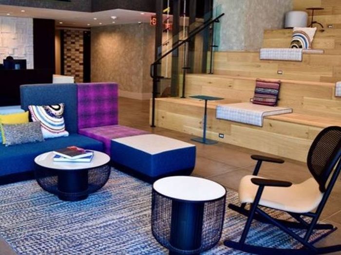 Stunning Two Story Lobby with Numerous Gathering Spaces and Stadium Style Seating with Media Outlets