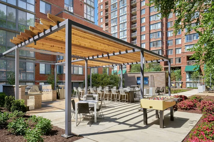 Newly Renovated Courtyard with BBQ Stations, Foosball, Televisions & More | Arlington, VA Apartments | Meridian at Courthouse Commons