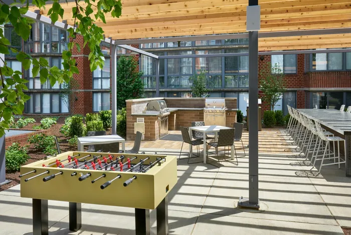 Challenge Your Neighbors to a Game of Foosball in the Courtyard | Meridian at Courthouse Commons | Luxury Arlington VA Apartments