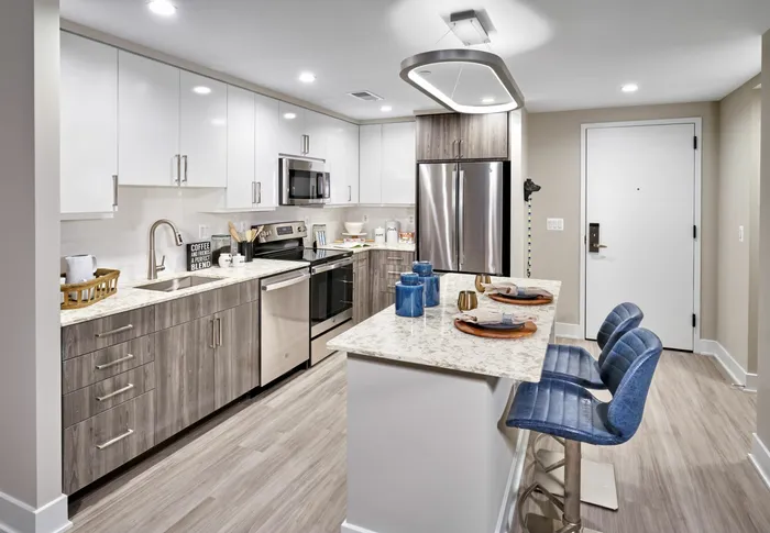 Expansive Kitchens With Quartz Countertops, Two-Tone Cabinetry, Energy Efficient Stainless Steel Appliances, Islands and Wood-Style Flooring | Meridian on First | Navy Yard Apartments | Washington DC Apartments