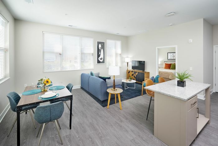 Robinson at One University Living Room & Kitchen Island | Affordable Fairfax VA Apartments