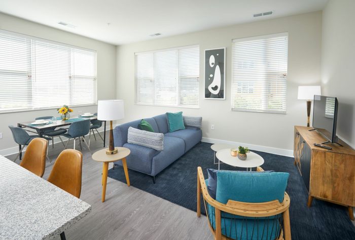 Living/Dining Area With Wood-Style Flooring | Robinson at One University | Affordable Fairfax VA Apartments