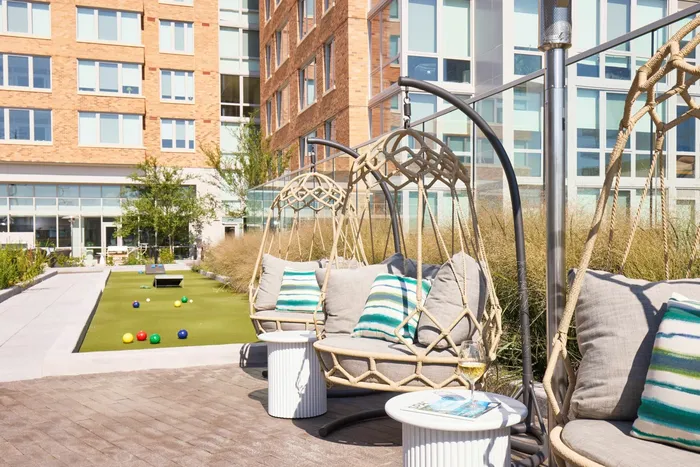 Plaza Swing Chairs & Lawn Game Area | Meridian 2250 at Eisenhower Station | Luxury Alexandria VA Apartments