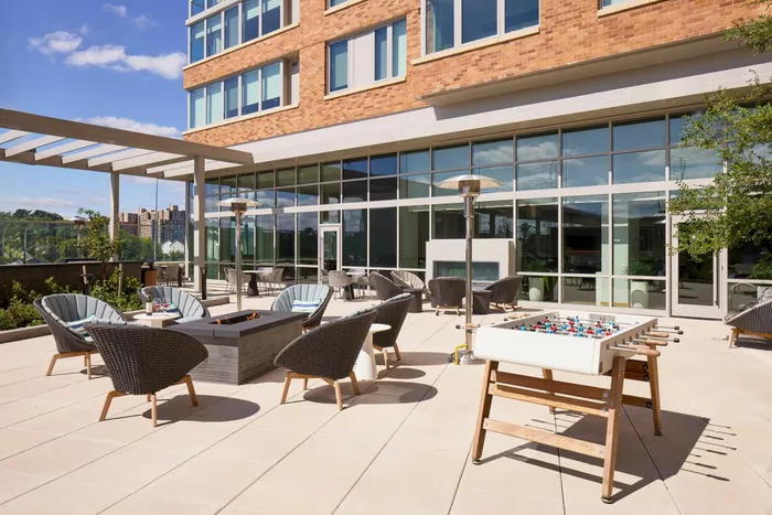 Plaza Seating Area With Fire Pit & Foosball | Meridian 2250 at Eisenhower Station | Luxury Alexandria VA Apartments