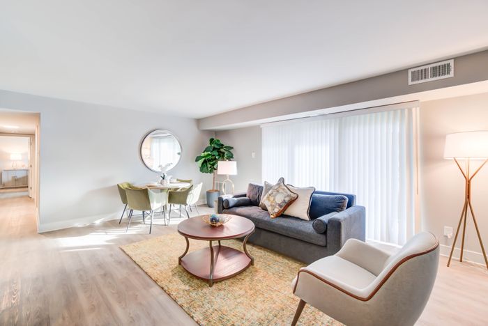 Spacious Newly Renovated Living Areas With Wood-Style Flooring | Creekside Village | Affordable Alexandria VA Apartments