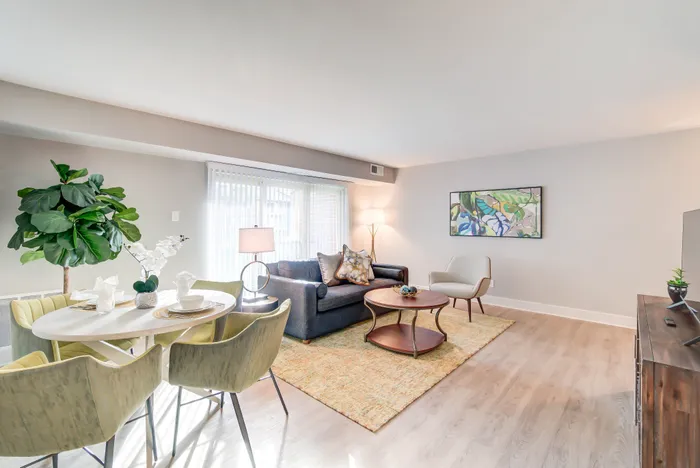 Newly Renovated Living/Dining Areas With Wood-Style Flooring| Creekside Village | Affordable Alexandria VA Apartments