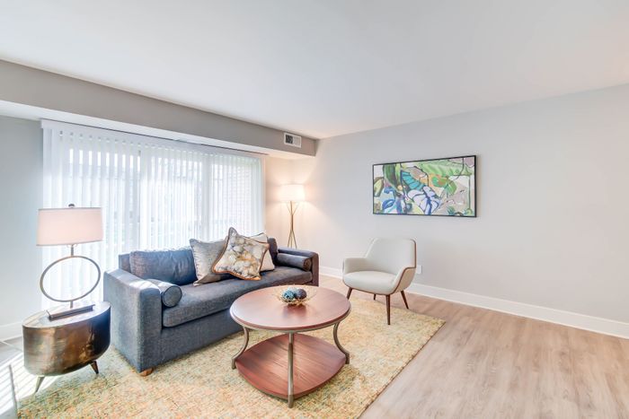 Spacious Newly Renovated Living/Dining Areas With Wood-Style Flooring| Creekside Village | Affordable Alexandria VA Apartments