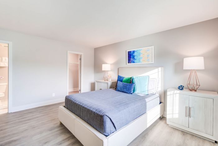 Large Newly Renovated Bedrooms with Wood-Style Flooring, Oversized Windows & Great Closet Space | Creekside Village | Affordable Alexandria VA Apartments